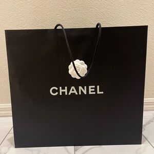 CHANEL Black Shopping Bag with White Camellia Accent